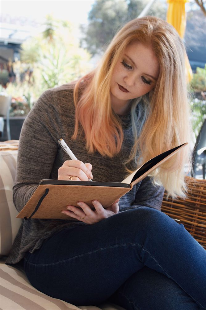Sumarie Engelbrecht making notes during a counselling session